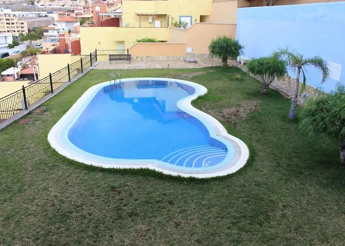 With A Serene Ocean And Mountain View