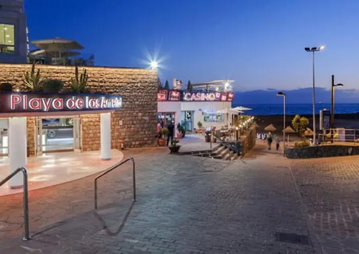 With A Serene Ocean And Mountain View