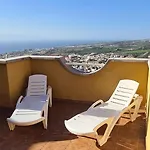 With A Serene Ocean And Mountain View Apartment