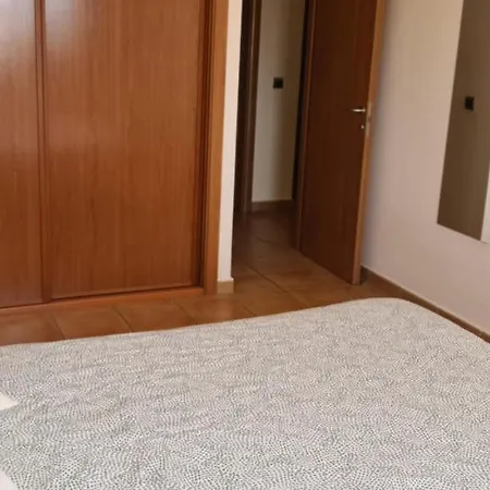 With A Serene Ocean And Mountain View