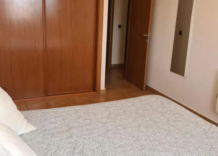 With A Serene Ocean And Mountain View